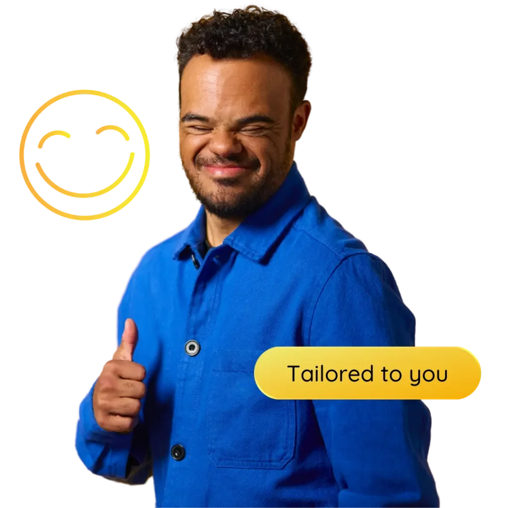 A disabled man smiling while doing a thumbs up